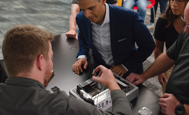 Group of professionals watching a server build demonstration